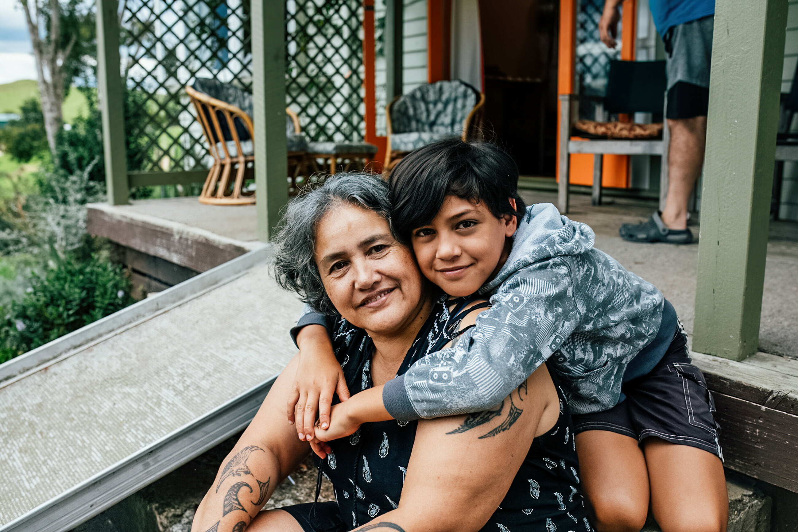 Elder hugged by child