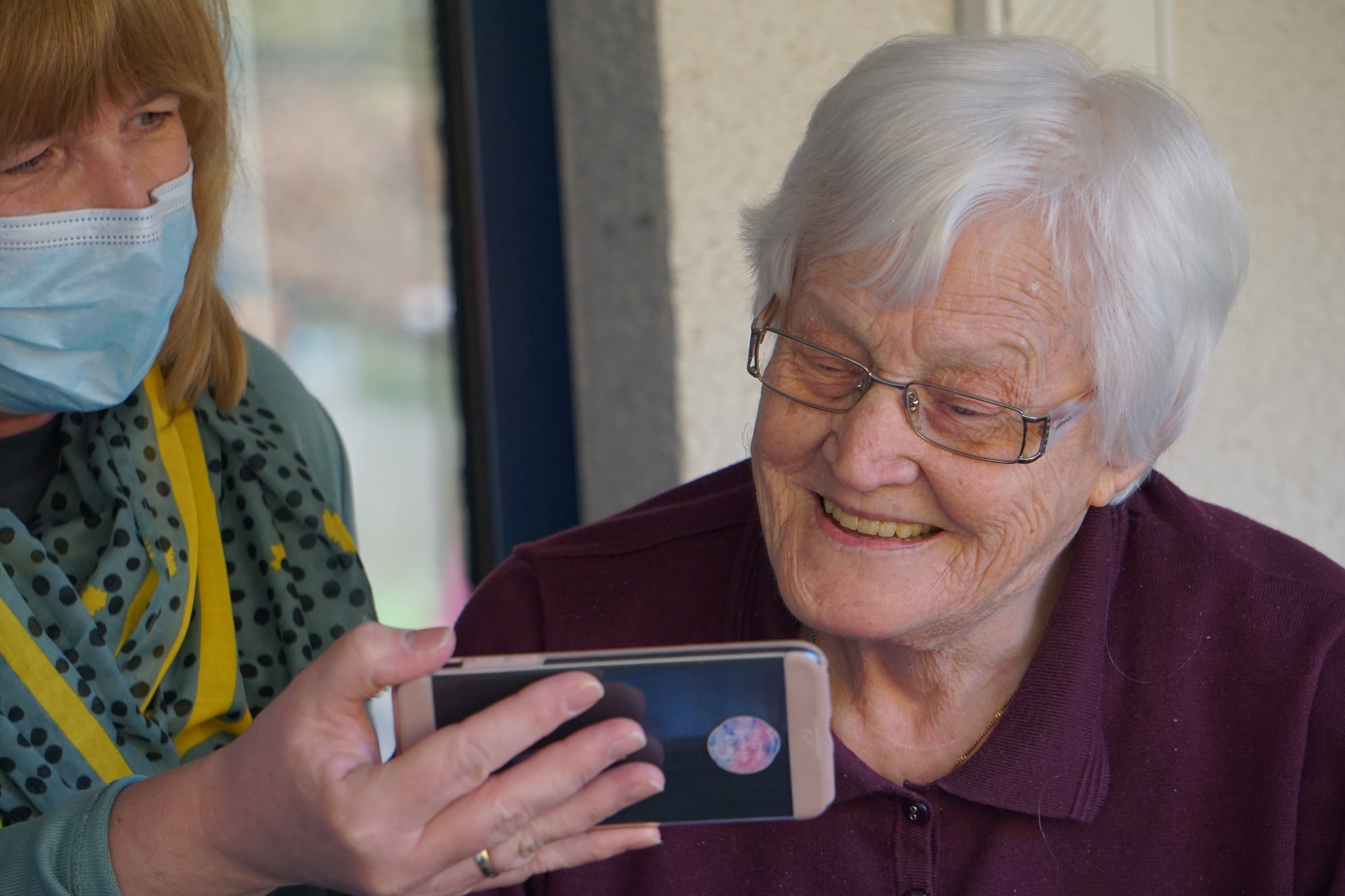 An Elderly person watching a video